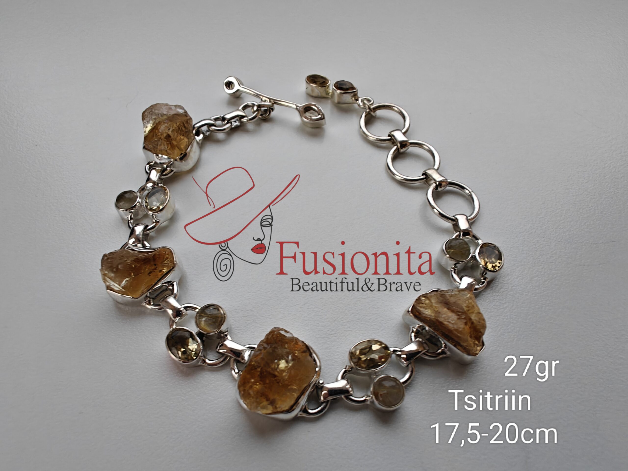 Hõbedast käekett, kus on vaheldumisi suuremad toortsitriinid ja väikesed lihvitud tsitriini